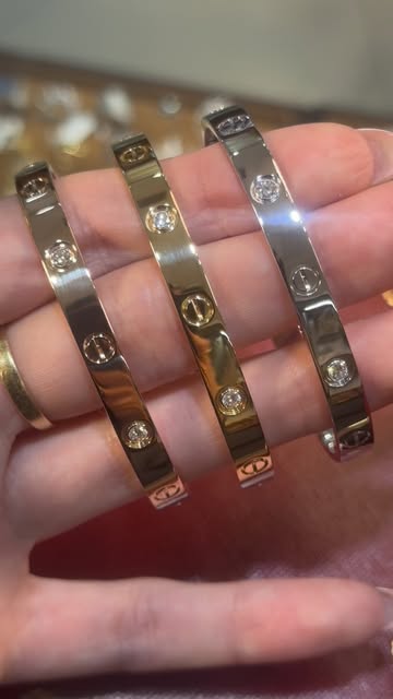 Three diamond bangle bracelets in yellow, rose and white gold