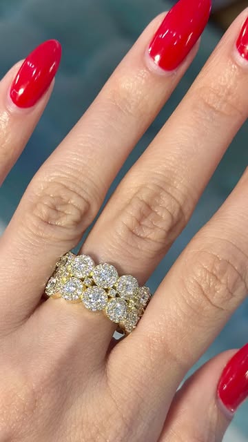 Double halo diamond ring in yellow gold worn on hand