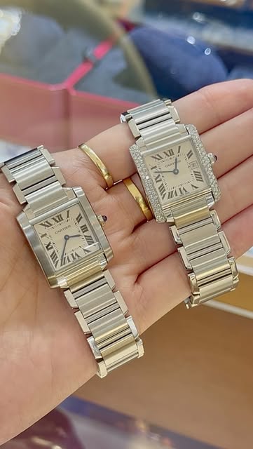 Two Cartier Tank Francaise watches, one with diamond bezel