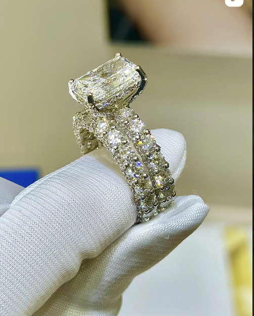 Radiant-cut diamond engagement ring with pavé band